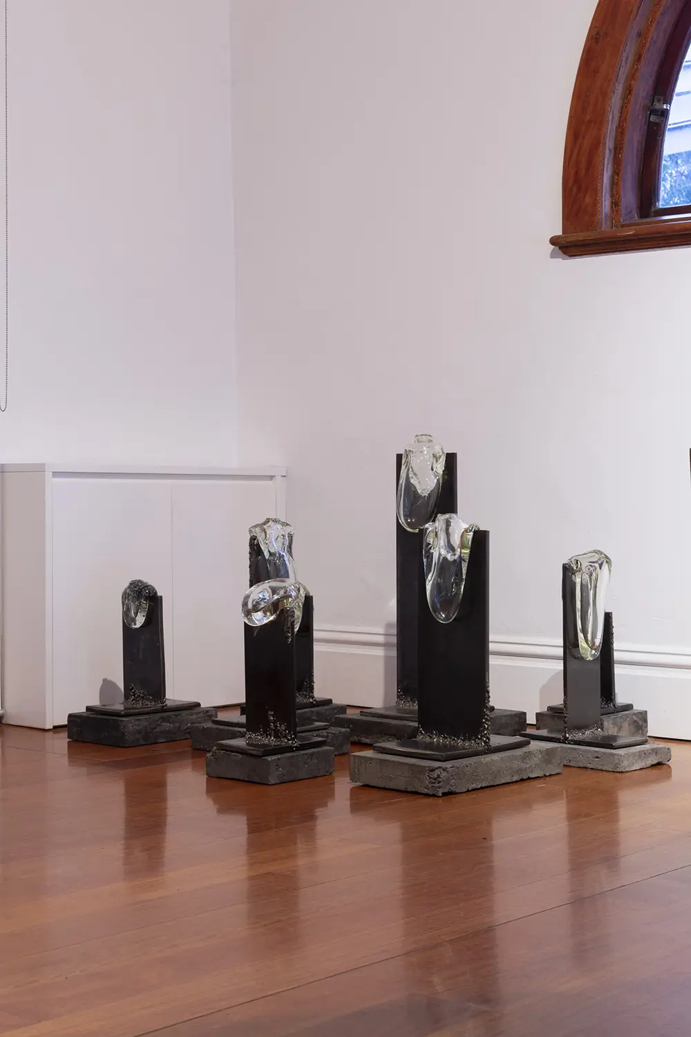 Stevie-Fielsdsend_As-we-melted-into-eachother-series.-Mixture-of-clearmirrored-silver-speckled-glass-steel-and-concrete-plinths-2020